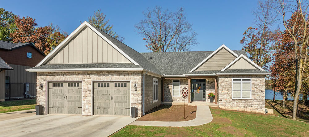 Exterior of custom modular home with two garages.